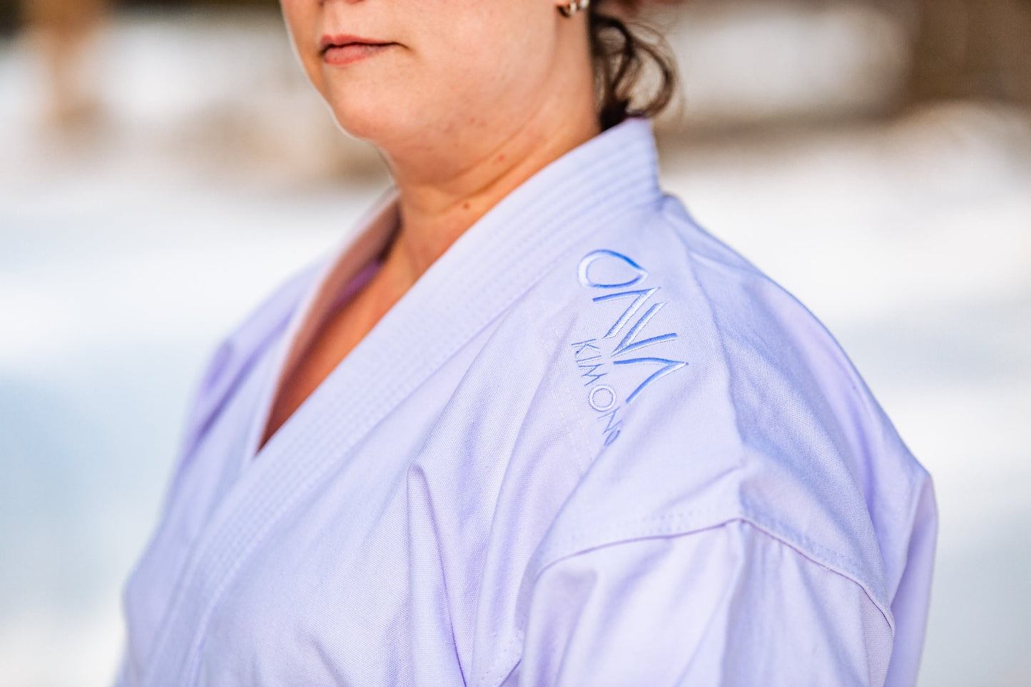 Onna kimono text embroidered at shoulder of karate uniform